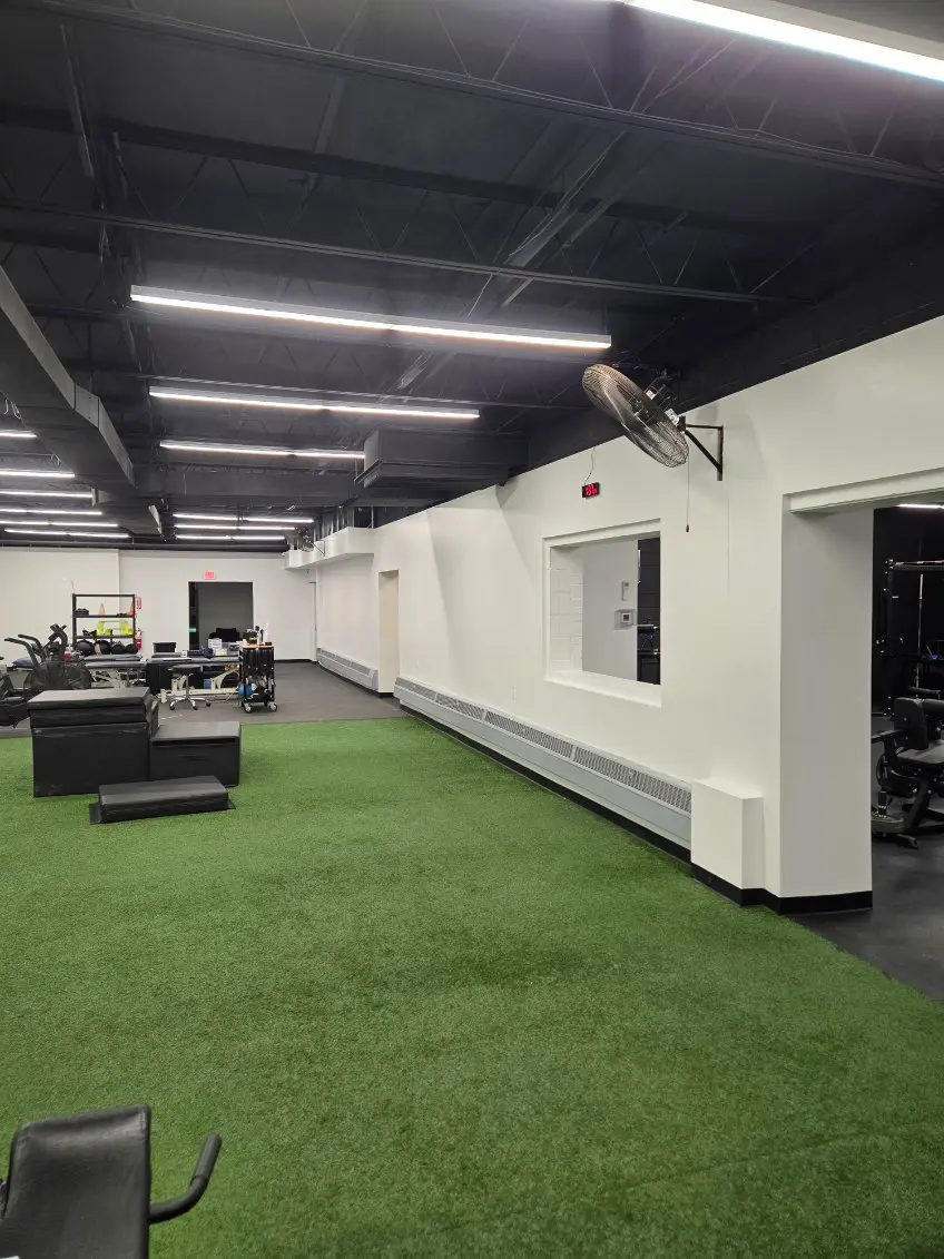 Commercial gym interior with painted ceilings and coated floors
