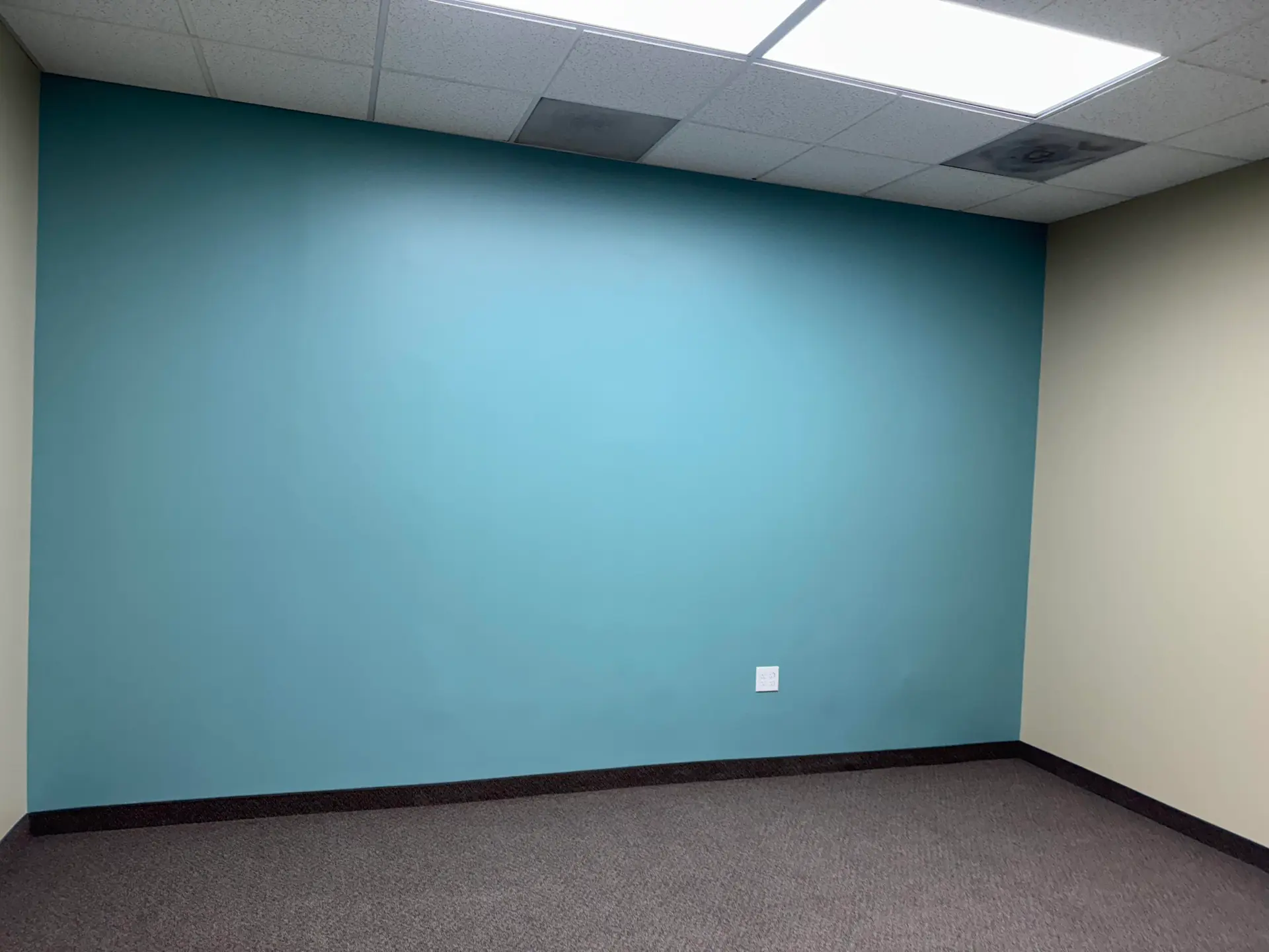 Clean teal commercial interior wall finish