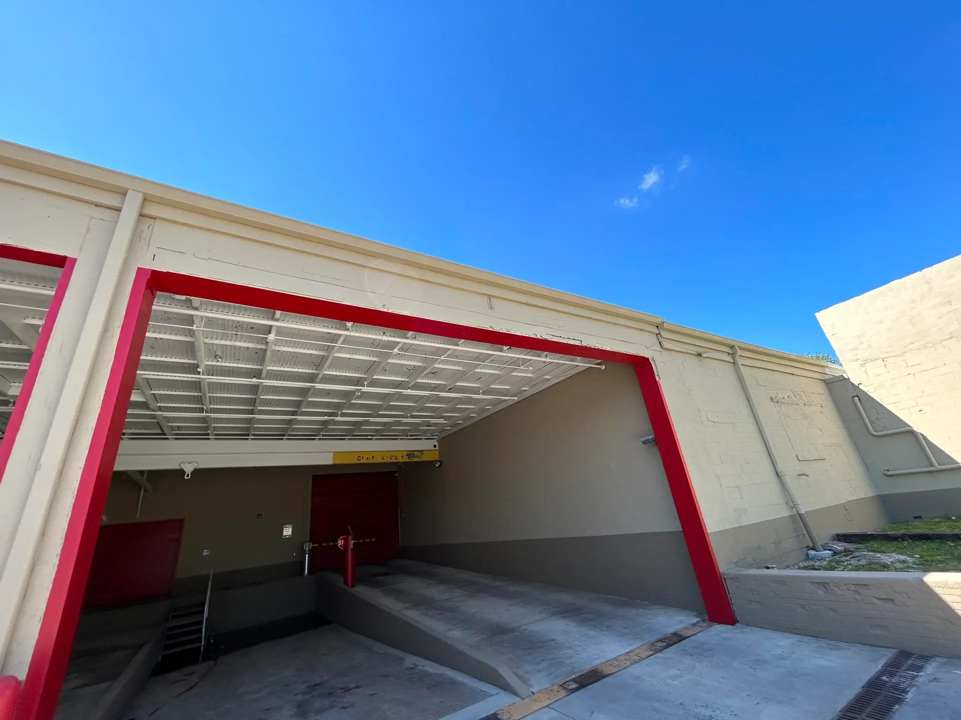 Loading bay exterior with freshly painted red trim