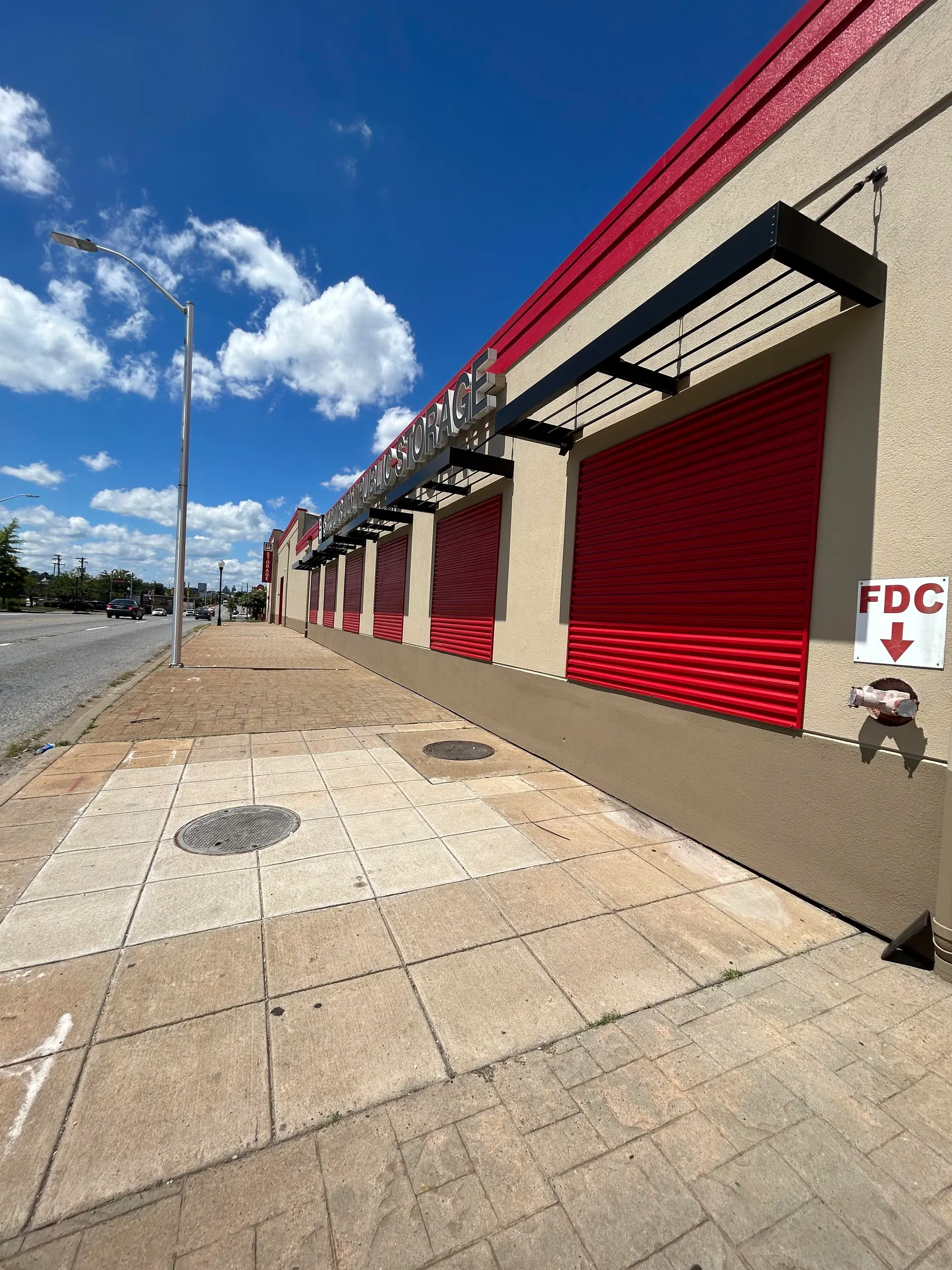 Commercial exterior painting on a Public Storage building